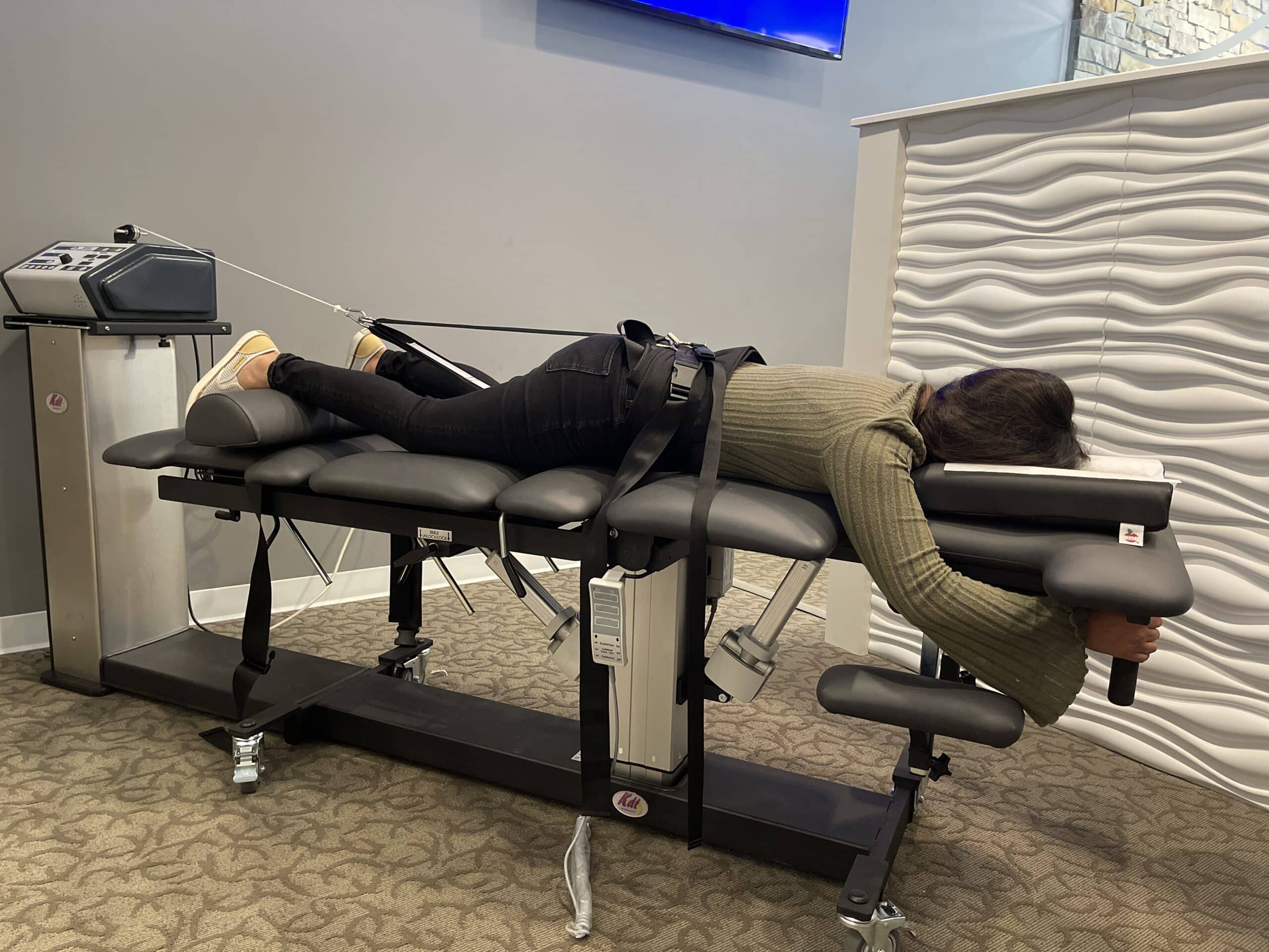 Patient positioned on a spinal decompression table at Life Source Chiropractic